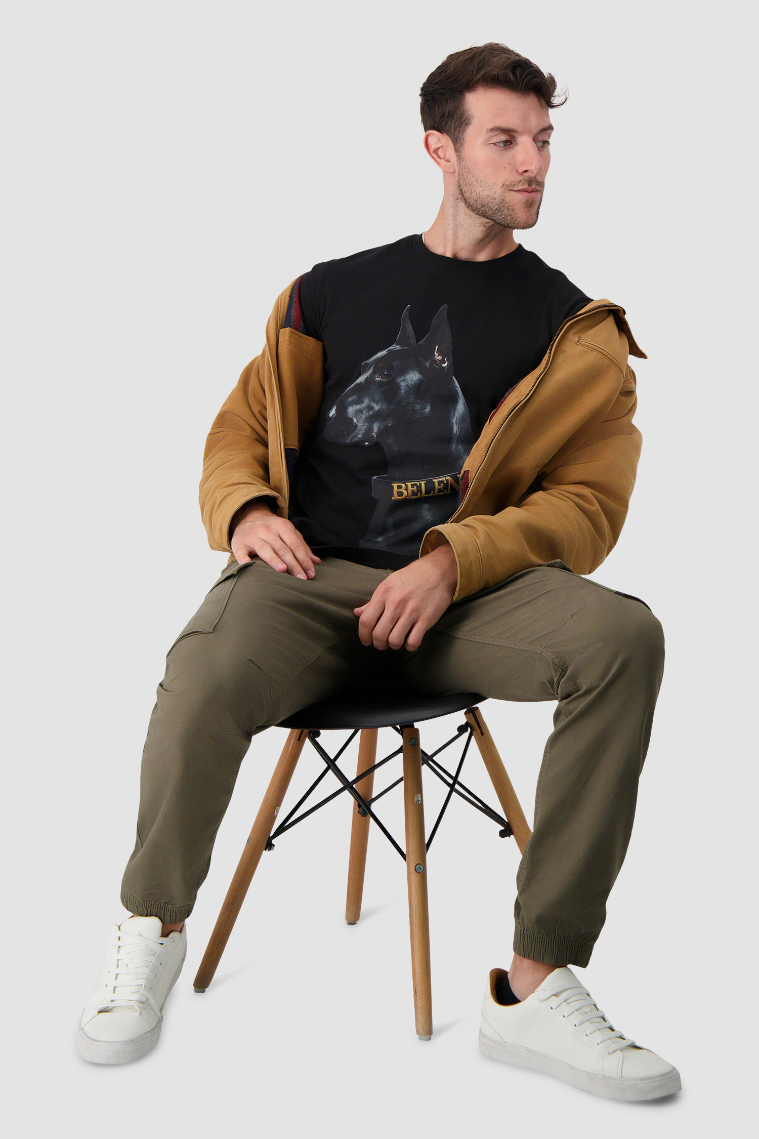 Streetwear look photographed in moody, low light.